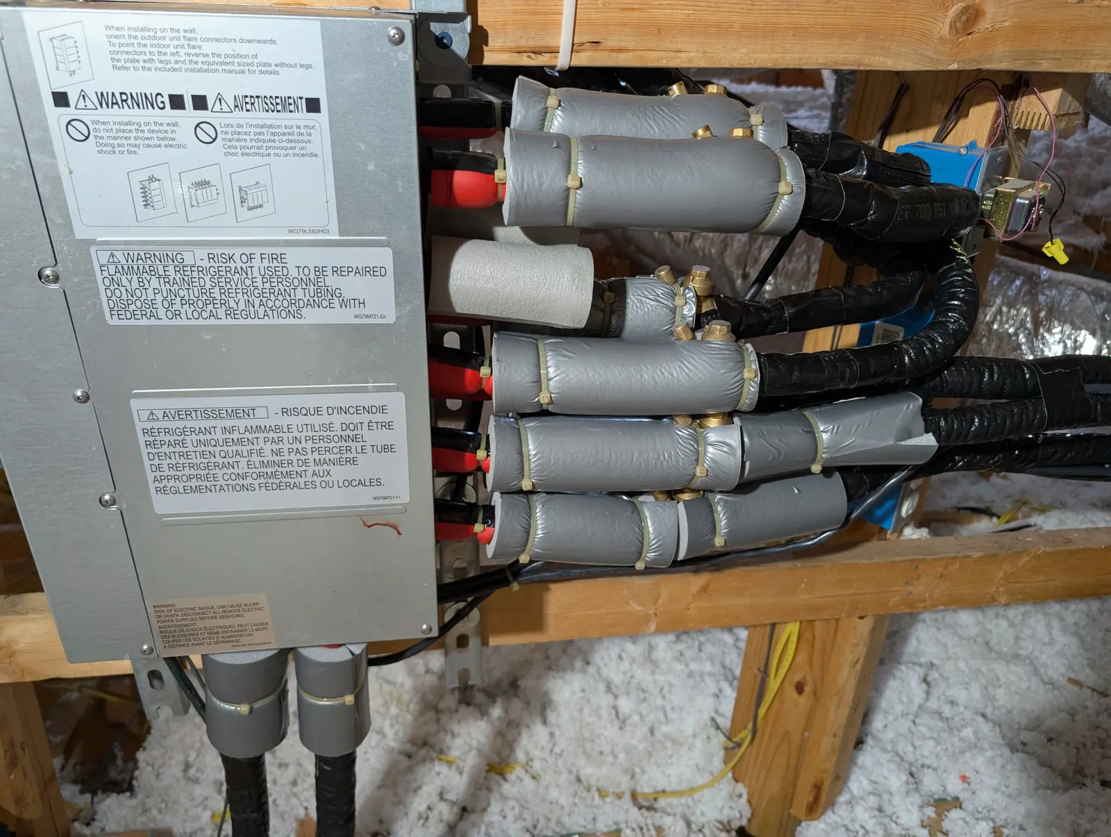 Multi-zone branch box with insulated refrigerant lines installed in an attic